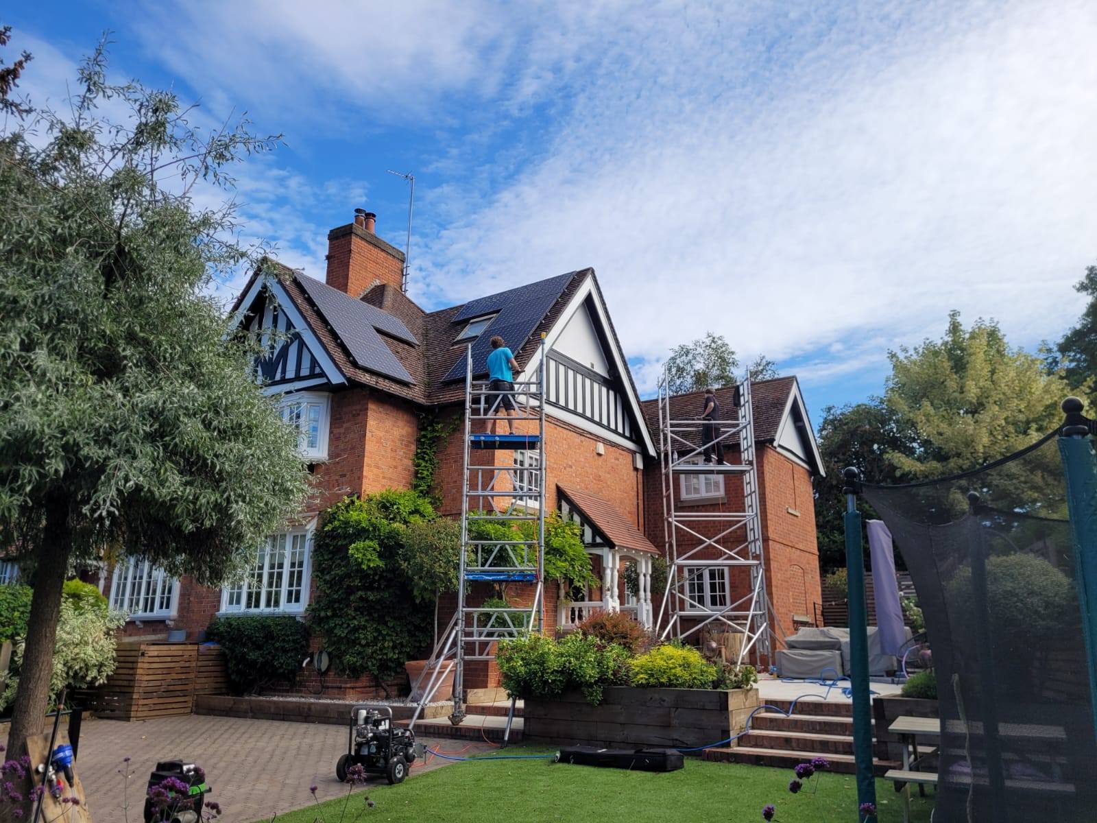 Before and after roof cleaning at a residential property in Leicestershire, showing cleaned roof tiles